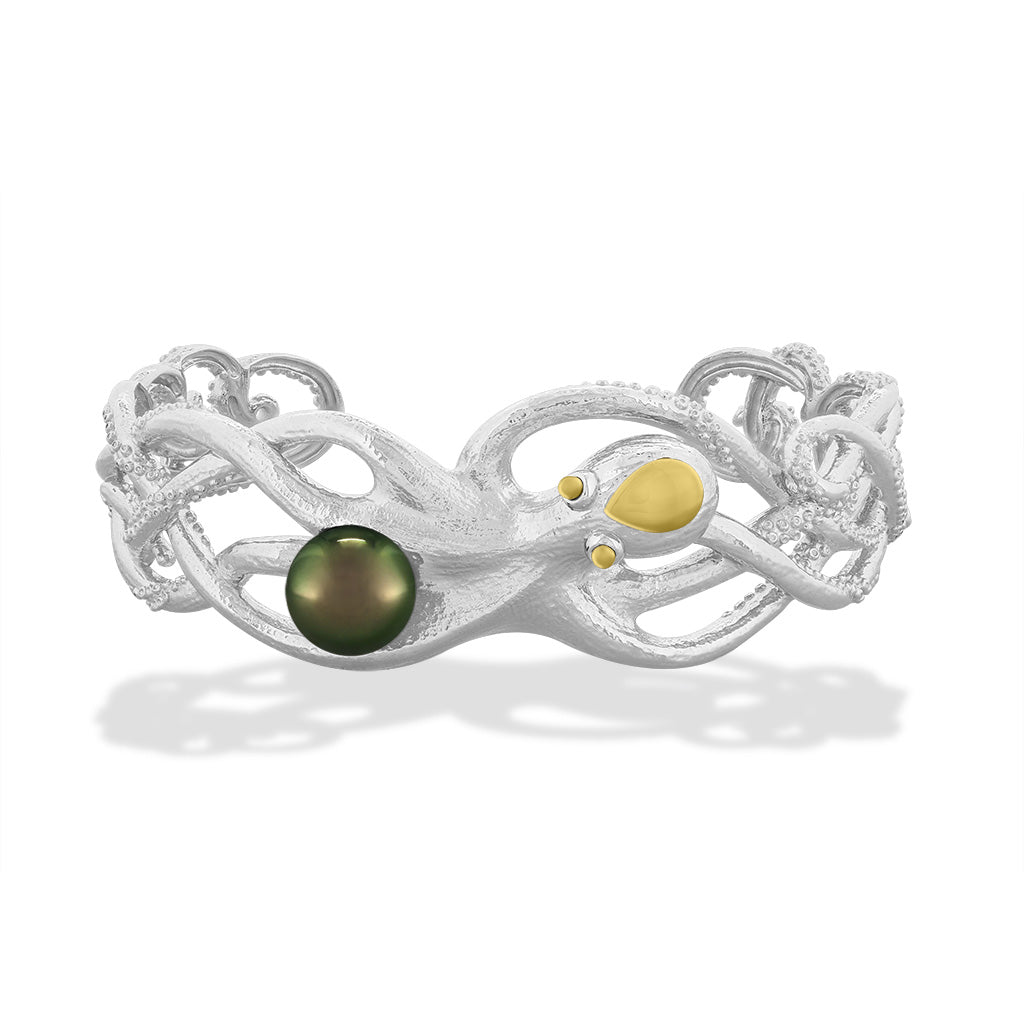 Octopus cuff bracelet in sterling silver with a 14k gold accented head & eyes, holding a 10mm tahitian pearl. Item No. 43468