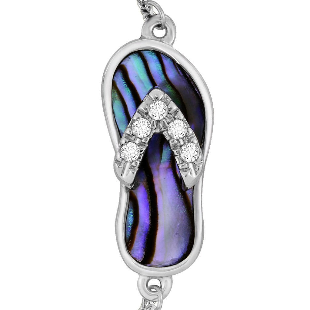 Zoomed view of the white gold abalone flip-flop charm showing brilliant diamonds set along the sandal straps. Item No. 43145