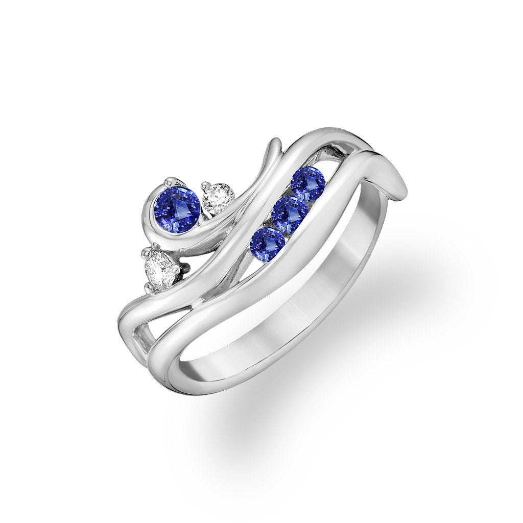 White gold ring with vivid blue sapphires and sparkling round diamonds in waterfall design. Item No. 43601