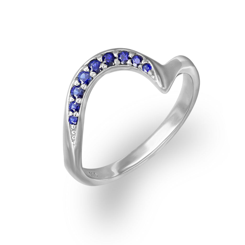Wave Band ring with 0.16 Carats of pavé-set Blue Sapphires set in 14K white gold, size 7. Item No. 43597