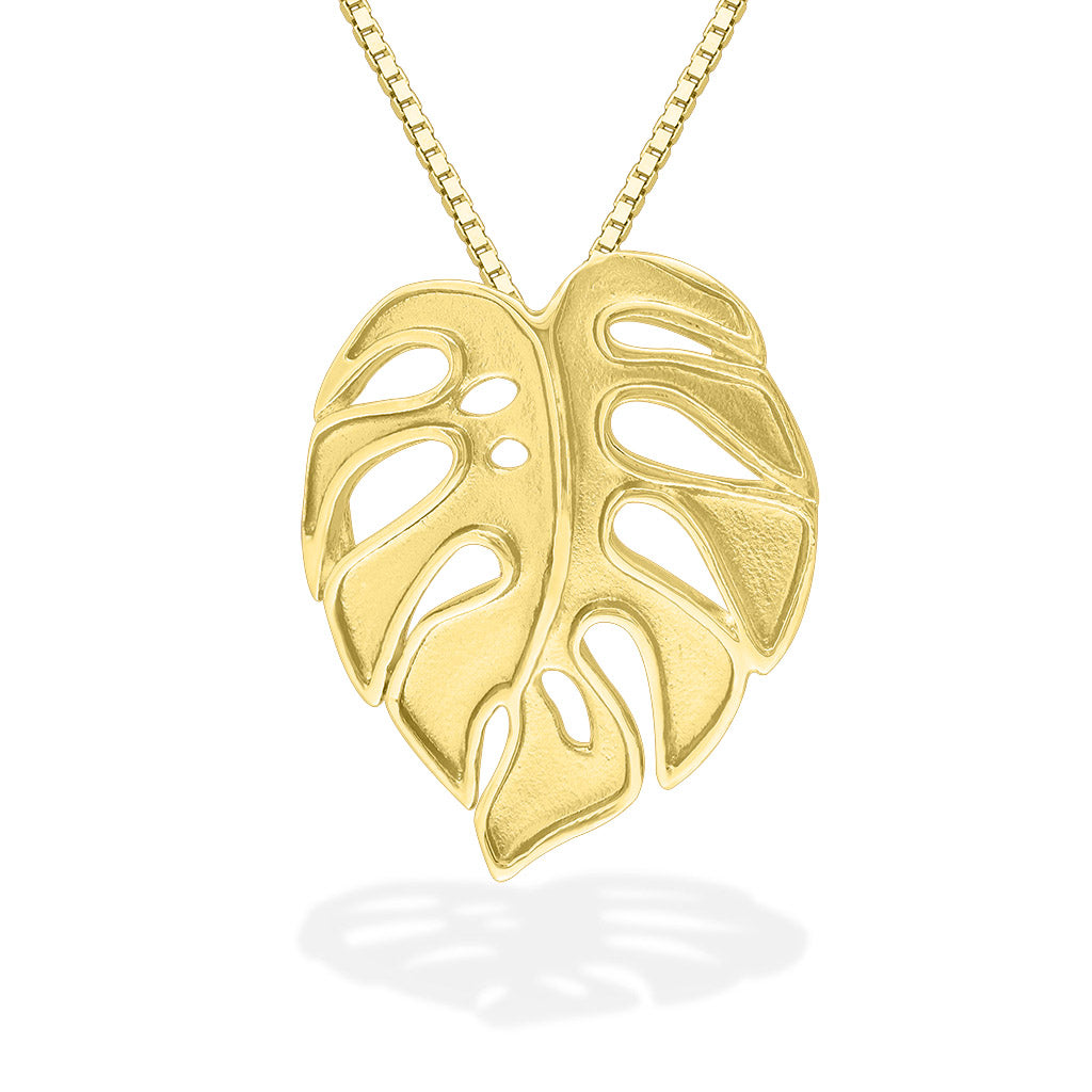 Large matte monstera leaf pendant with raised ploished edges made in 14k yellow gold. Item No. 43750