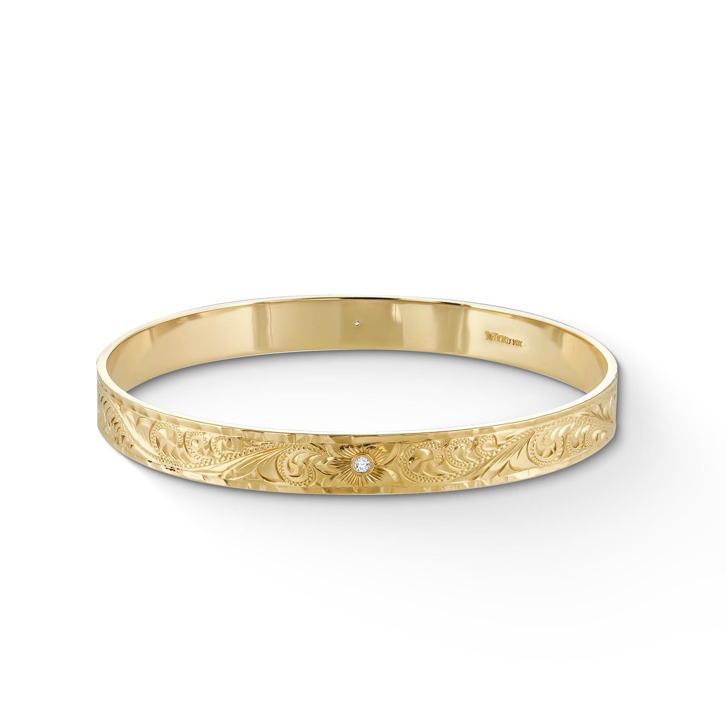 Solid yellow gold bangle with engraved royal scroll pattern around bracelet. Diamonds in center of flowers. Item No. 61324