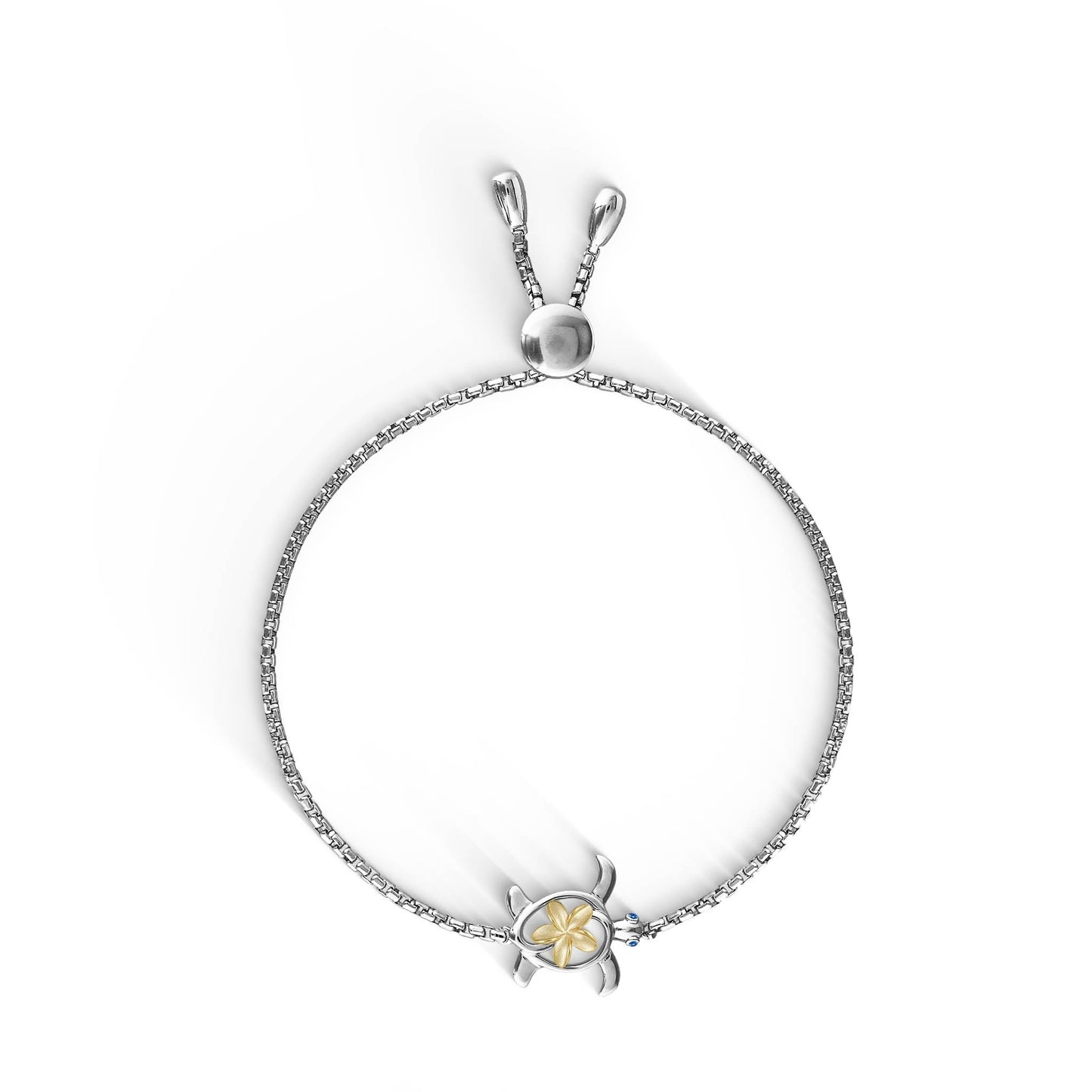 Charming sterling silver Honu bracelet with blue sapphire eyes, wearing a 14k gold plumeria on its shell. Item No. 44396
