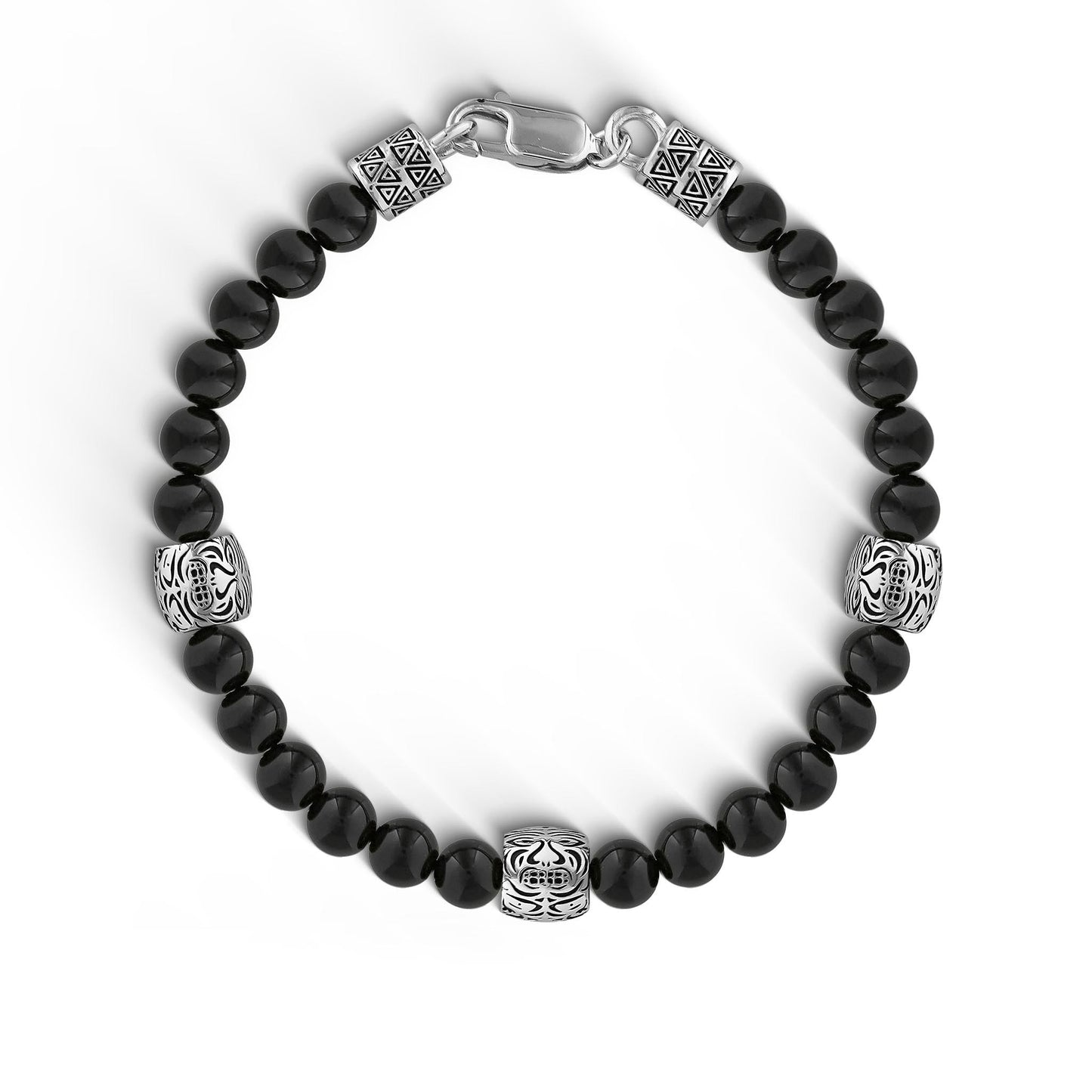 Black onyx bead bracelet with sterling silver tribal motif beads evenly spaced in between. Item No. 772889