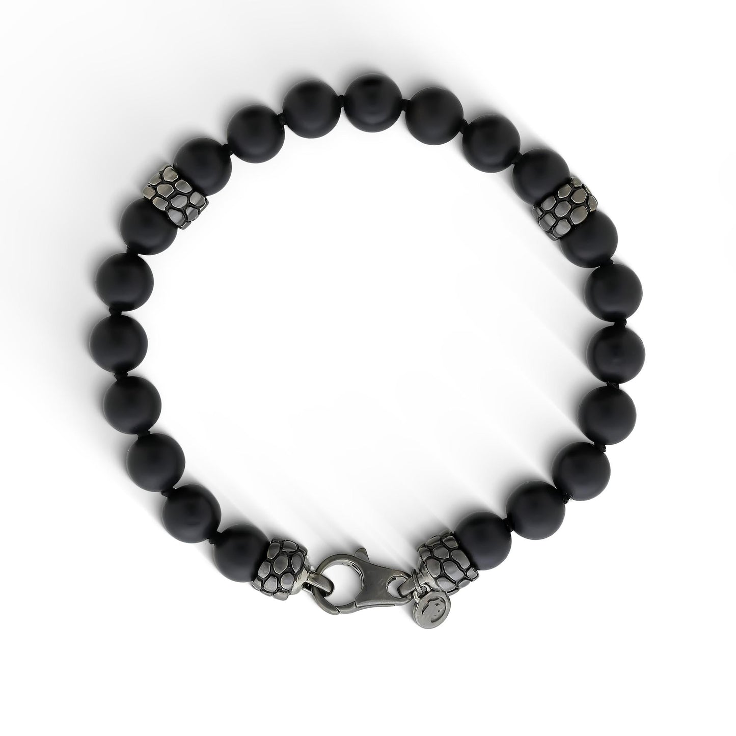 Bead bracelet with matte black onyx beads & sterling silver dragon scale-like beads evenly spaced throughout. Item No. 772890