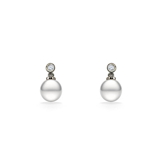 Drop earrings with white freshwater pearls beneath round white sapphires in a silver bezel setting. Item No. 44537
