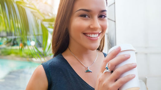 Woman wearing Na Hoku Whale Tail jewelry