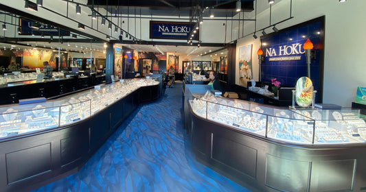 Na Hoku Jewelry store interior with display cases and 'Na Hoku' signs.