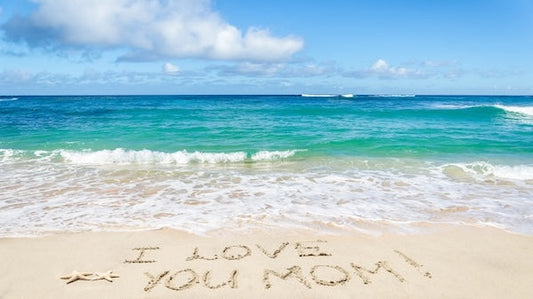 Beach "I love you Mom" written in sand