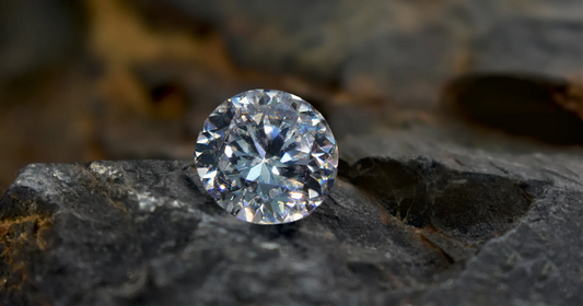 Round natural diamond on a textured stone surface