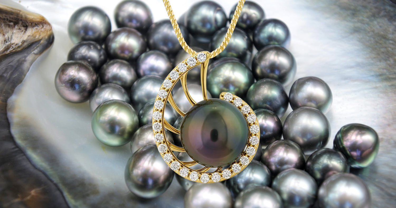 Gold Nautilus pendant with a Tahitian pearl on a bed of pearls background.