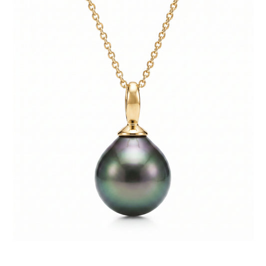 Minimalist 14k yellow gold chain featuring a single 9mm Tahitian pearl pendant for a timeless island look. Item No. 40499