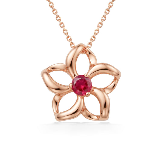 Radiant rhodolite garnet is in the center of a rose gold plumeria pendant with sculpted, open loop petals. Item No. 40030
