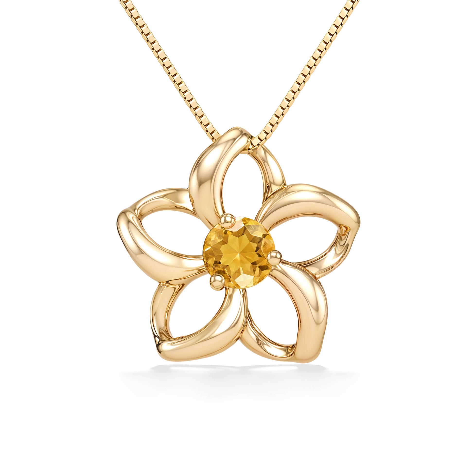 Open-petal flower pendant in yellow gold, highlighted by a citrine gemstone nestled in the center. Item No. 40042