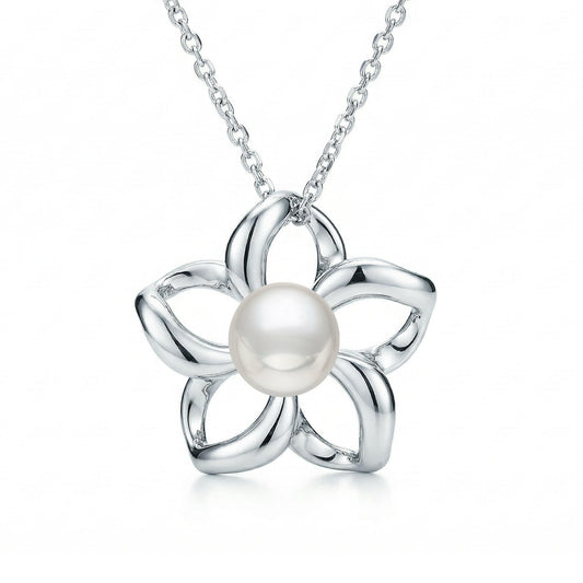 Minimalist floating plumeria charm crafted in gold, centered with a classic round pearl. Item No. 40059