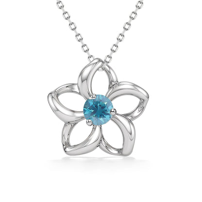 White gold pendant with open style petals resembling a floating plumeria with a blue zircon center stone. Item No. 40068