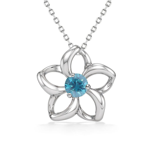 White gold pendant with open style petals resembling a floating plumeria with a blue zircon center stone. Item No. 40068