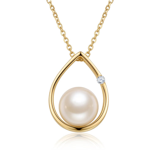 Luminous white akoya pearl in a 14k yellow gold raindrop shaped pendant, with a diamond detail. Item No. 19590