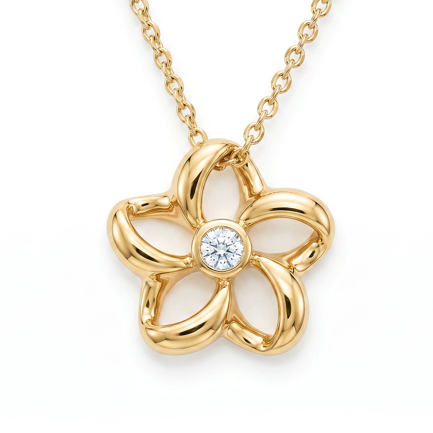 Refined floating plumeria pendant with a bezel-set diamond in the center. The plumeria is in 14K yellow gold. Item No. 18806
