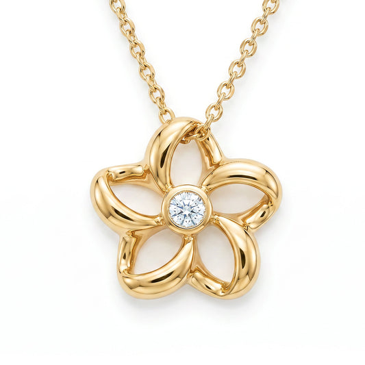 Refined floating plumeria pendant with a bezel-set diamond in the center. The plumeria is in 14K yellow gold. Item No. 18806