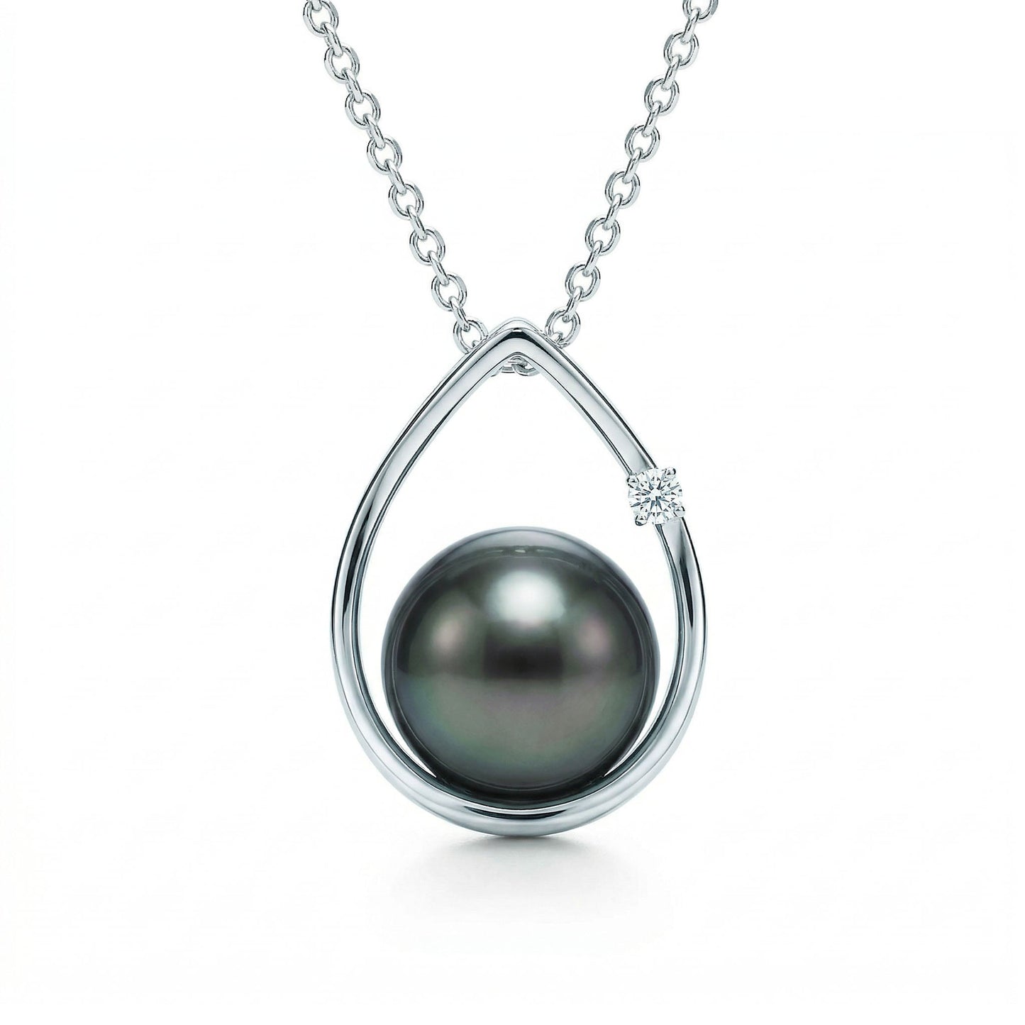 Elegant 14k white gold raindrop pendant with a 8.5-9mm tahitian pearl and single round diamond on box chain. Item No. 19153