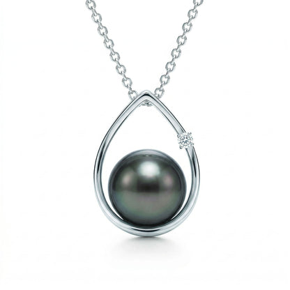 Elegant 14k white gold raindrop pendant with a 8.5-9mm tahitian pearl and single round diamond on box chain. Item No. 19153