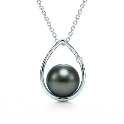 Elegant 14k white gold raindrop pendant with a 8.5-9mm tahitian pearl and single round diamond on box chain. Item No. 19153