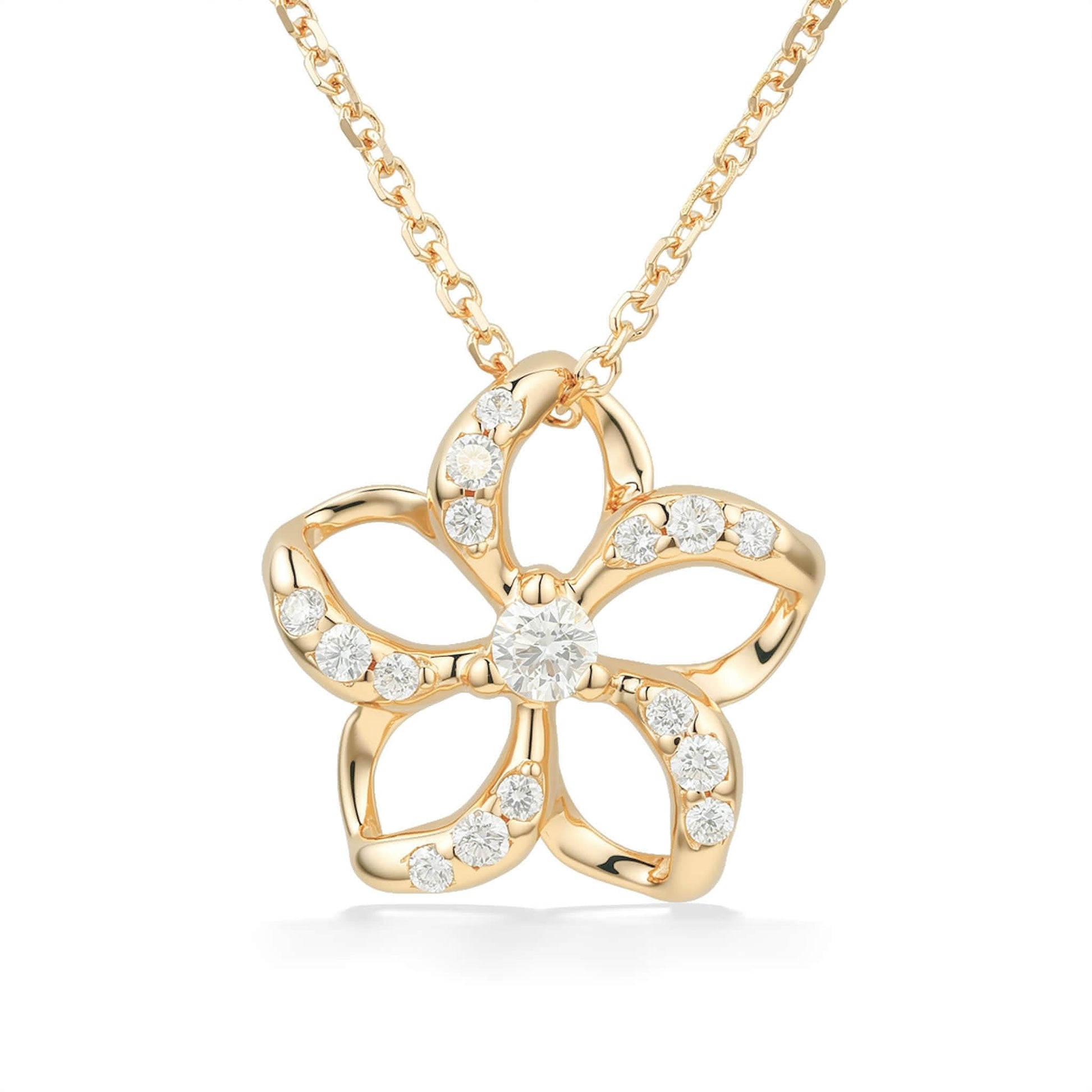 Sophisticated plumeria pendant with diamond-lined hollow petals and center diamond set in yellow gold. Item No. 19343