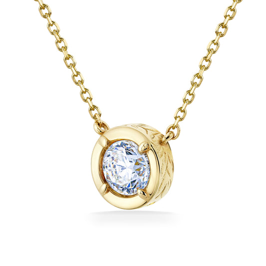 Round-cut 0.50 CT diamond pendant held in a maile scroll detailed 14k yellow gold setting with a fine chain. Item No. 41953