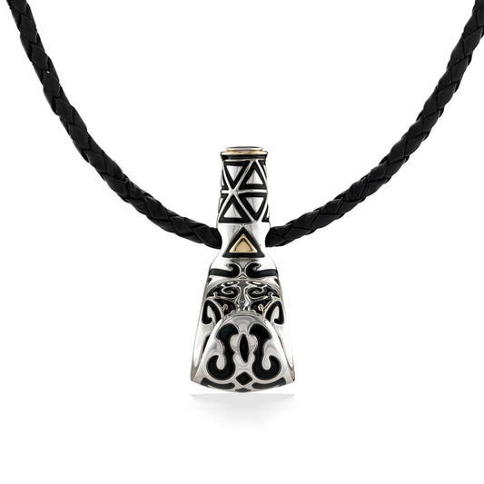 Sterling silver palaoa pendant with tribal engravings and 18k gold accents on a braided leather cord. Item No. 41528