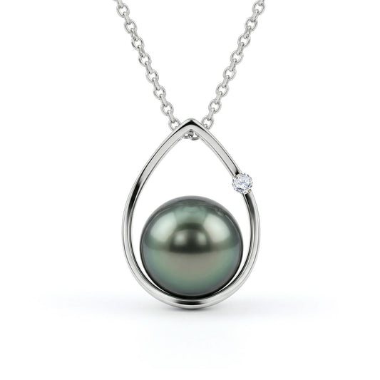 White gold teardrop-shaped pendant with a 7mm peacock Akoya pearl and a single diamond accent on a chain. Item No. 41326