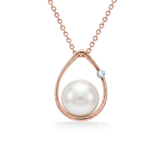 Raindrop shaped pendant made in 14k rose gold with white akoya pearl and diamond accent. Item No. 41230