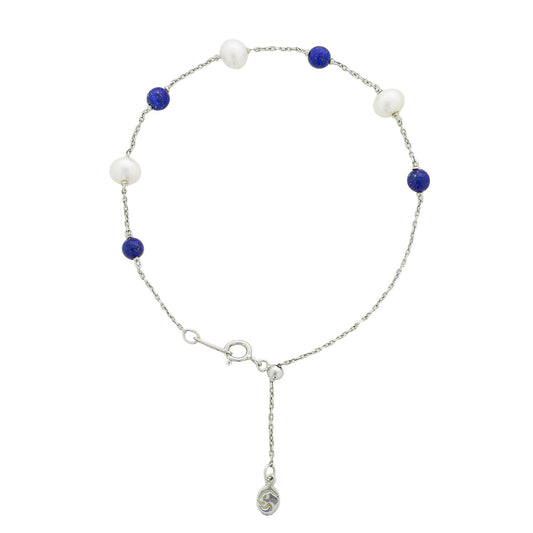 Bracelet alternating white freshwater pearls & lapis beads on a sterling silver chain with adjustable clasp. Item No. 700738