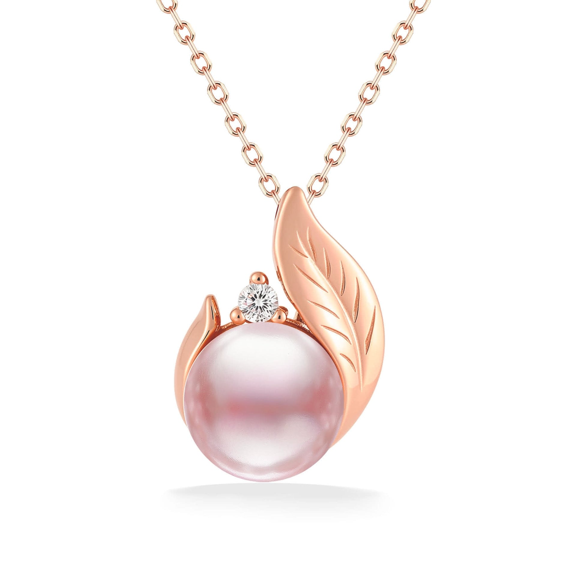 Blush pink 7mm freshwater pearl rests in a 14K rose gold maile leaf pendant with a diamond on top the pearl. Item No. 41452