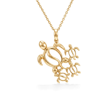 Hawaiian honu ohana pendant made in 14k yellow gold featuring a family of sea turtles on a delicate chain. Item No. 41589