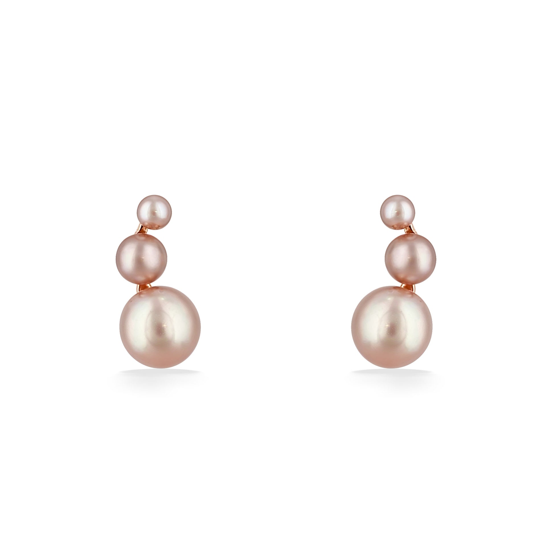 Graduated pearl stud earrings feature three softly glowing pearls stacked vertically in warm rose gold. Item No. 700677
