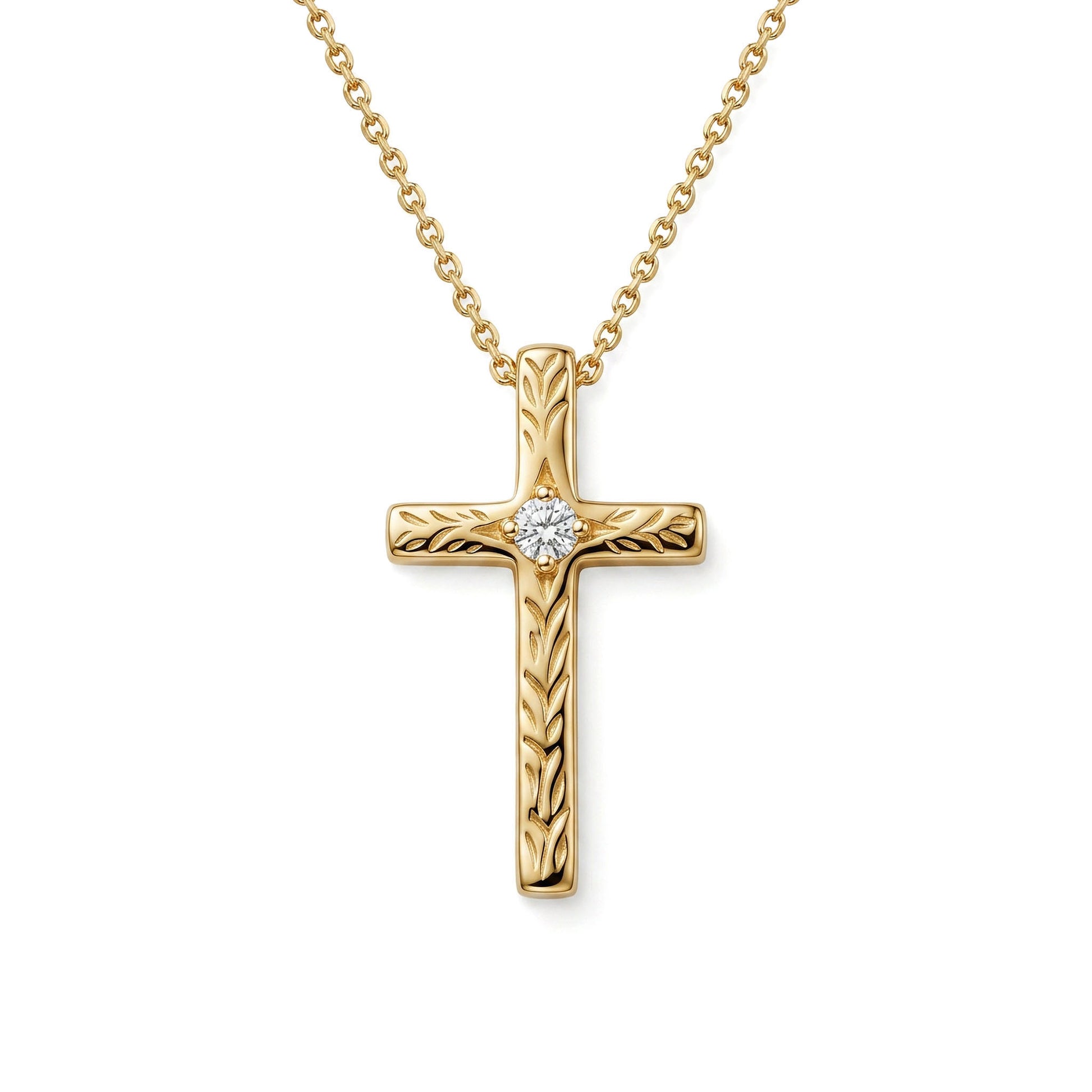A 14K yellow gold cross pendant adorned with maile scroll engraving and a 0.02 carat diamond center. Item No. 40445