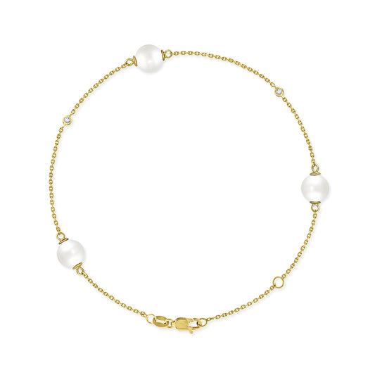 Yellow gold bracelet with 3 white Akoya pearls and bezel-set diamond accents arranged along a delicate chain. Item No. 43313