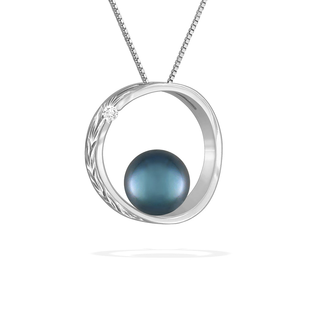 White gold moon and star scroll pendant showcasing 7mm blue Akoya pearl with subtle diamond detail. Item No. 43167