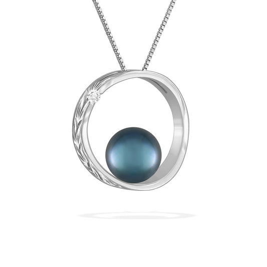 White gold moon and star scroll pendant showcasing 7mm blue Akoya pearl with subtle diamond detail. Item No. 43167