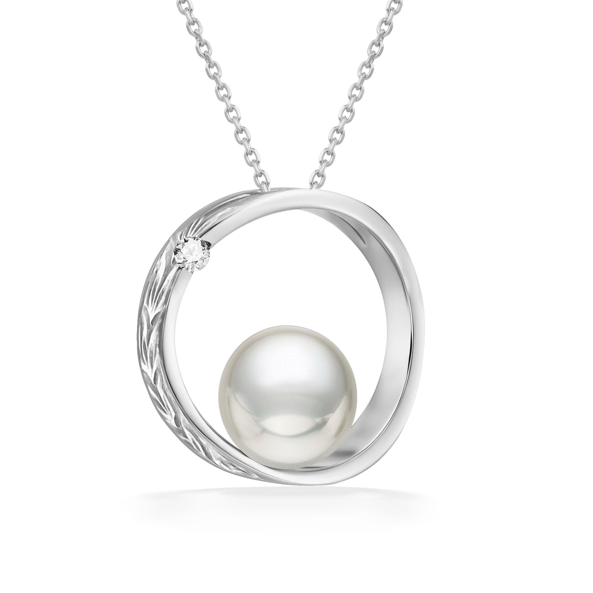 Polished white gold scroll design surrounds a 7mm white Akoya pearl, finished with a 0.02 carat diamond. Item No. 43163