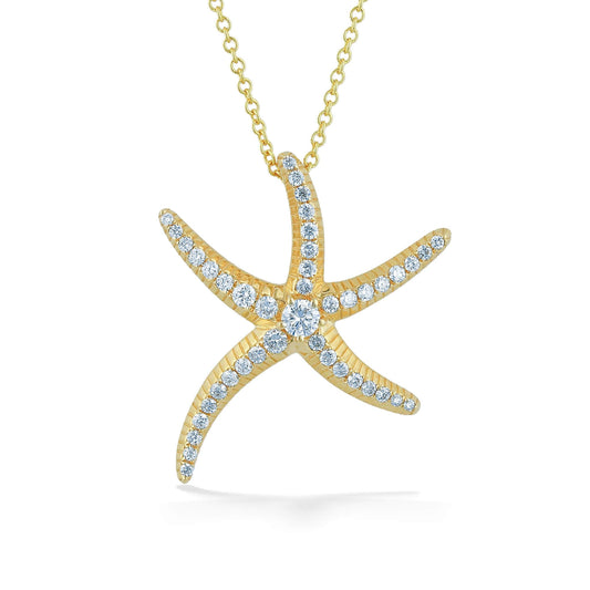 Slim and elegantly detailed 14k yellow gold starfish pendant necklace lined with diamonds. Item No. 770531