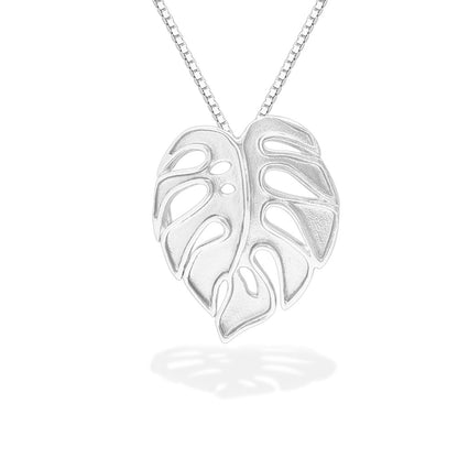 Close view of 14k white gold monstera pendant on chain with matte open leaf detailing. Item No. 43749