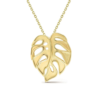 Close view of gold monstera necklace showing polished surface and organic leaf shape. Item No. 43748