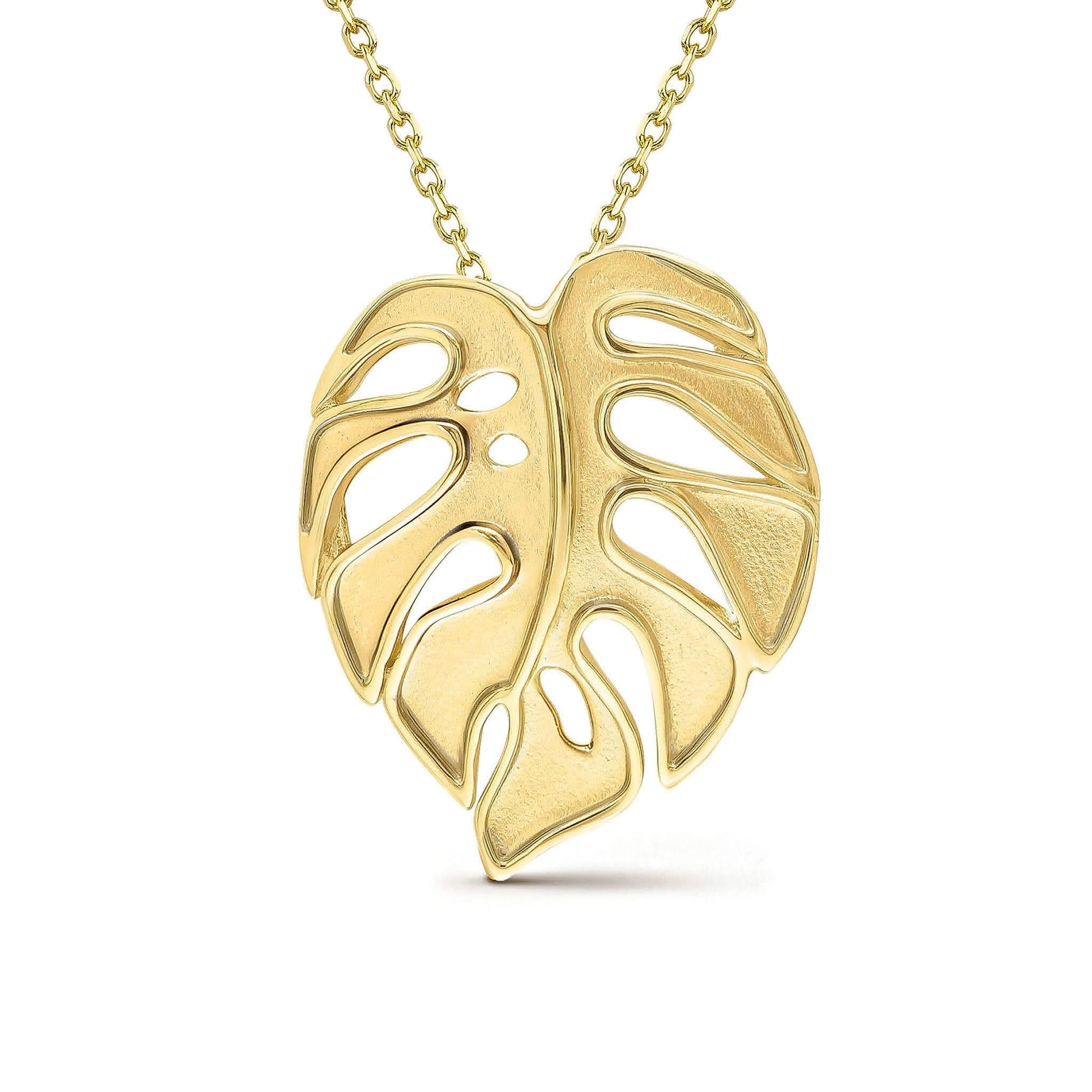 Large matte monstera leaf pendant with raised polished edges made in 14k yellow gold. Item No. 43750