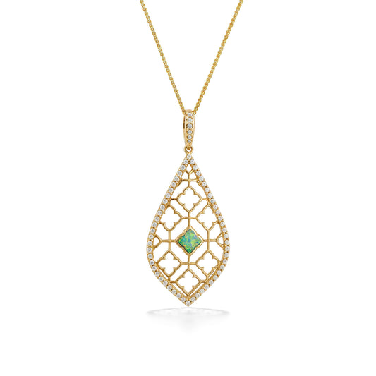 Gold pendant with a delicate, elegant filigree design, lined with diamonds & a radiant opal centerpiece. Item No. 772965