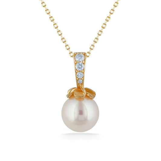 White akoya 7mm pearl pendant with a 14k yellow gold, pavé-set diamond, plumeria bail pearl cap. Item No. 44701