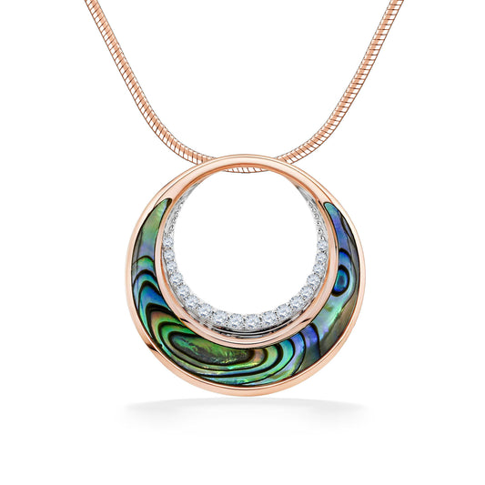 Crescent shaped abalone inlay on bottom of gold circle pendant, lined with diamonds on inner circle. Item No. 45127