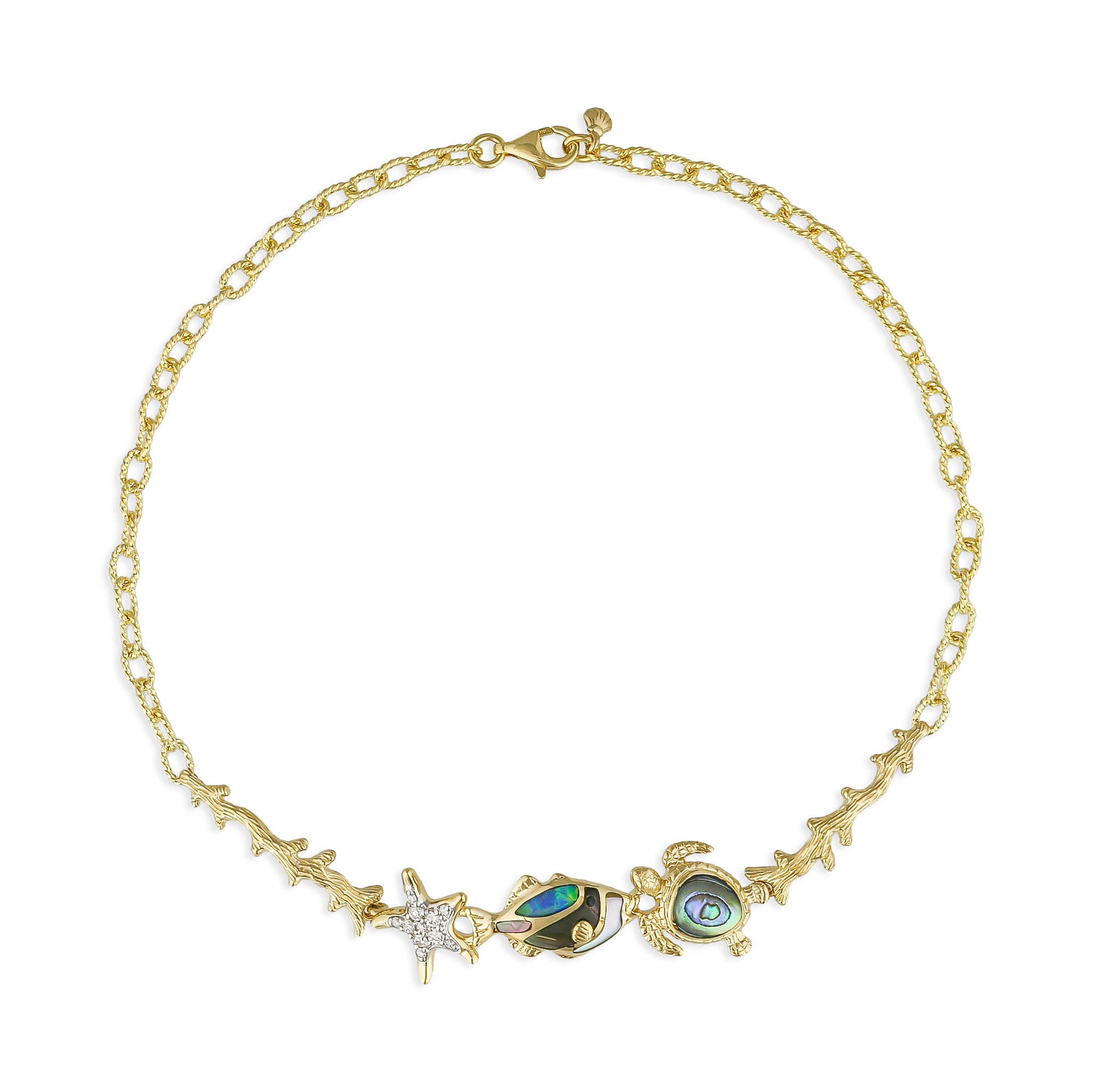 Gold textured link bracelet with a diamond starfish charm, fish & turtle charms with inlay between gold coral. Item No. 45200