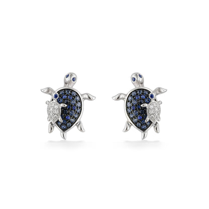 Turtle studs featuring blue sapphire-set shells & eyes, and diamond baby turtles, made in 14k white gold. Item No. 774013
